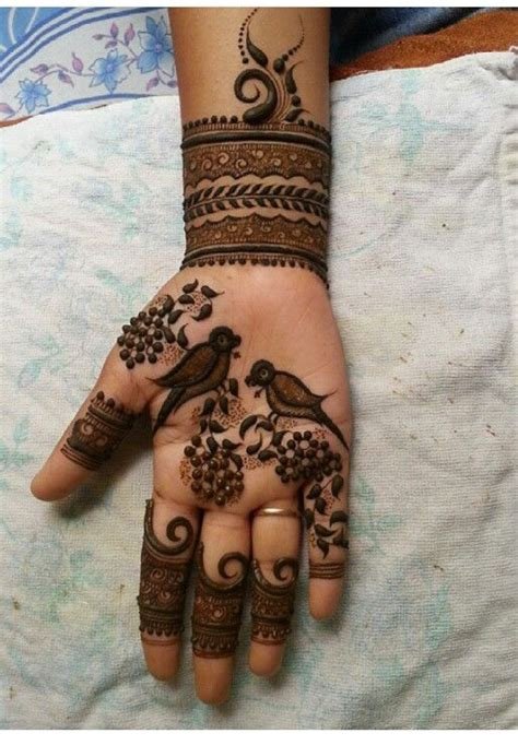 1_elegant birds and swirls mehndi design on front hand for girls